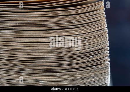 Many rough notebook pages, close up. Vintage paper texture background. Book pages with fiber pattern Stock Photo