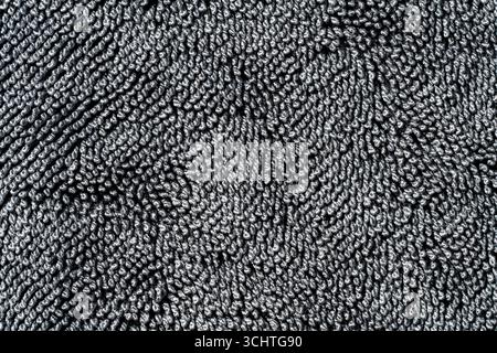 Black microfiber fabric texture for background, close up. Microfiber car cloths, macro Stock Photo
