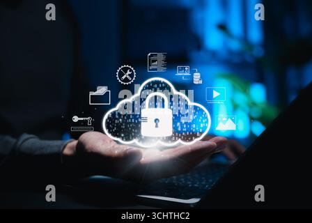Cloud Security and Data Protection Concept. Man holding cloud security with a glowing lock icon, symbols of files, data, and technology, Stock Photo