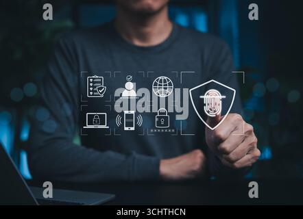 Cybersecurity and Biometric Identity Authentication System. Person using fingerprint scanning technology with icons represent security protocols, data Stock Photo