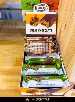 Uzhhorod, Ukraine - September 03, 2025: Bolci Dubai chocolate bars with pistachio and hazelnut filling in branded retail display box Stock Photo