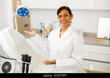 Latino american cosmetician welcoming to cosmetology clinic Stock Photo