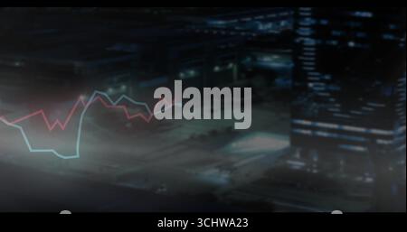 Displaying red and blue line graphs over blurry night road showing skyscraper and streetlights Stock Photo