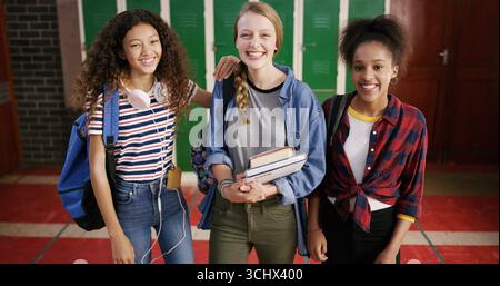 High school students, girls and happy with portrait for education, learning break and scholarship. Teenager, friends and smile with textbooks in Stock Photo