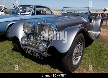 Three-quarters front view of a  2016, Silver, Suffolk SS100 Replica, on display at the Deal and Walmer Classic Car Show 2025. Stock Photo