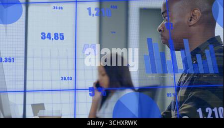 Analyzing man in dark striped sweater reviewing projected charts on glass in office, copy space Stock Photo