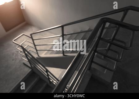 Fire exit staircase down way for emergency escape from building in case of fire Stock Photo