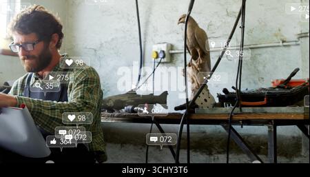Working man wearing apron, glasses at workshop bench using drill on model plane part, copy space Stock Photo