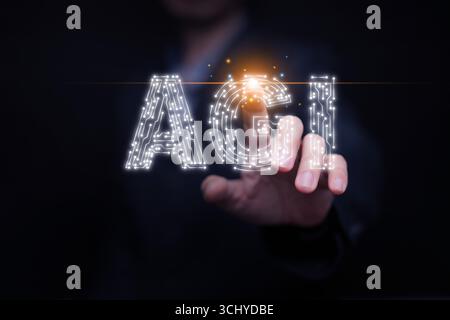 Futuristic concept of AGI with human interaction, glowing circuit letters symbolizing consciousness, self-awareness, human-AI connection, and the phil Stock Photo