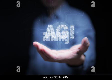 Futuristic concept of AGI with human interaction, glowing circuit letters symbolizing consciousness, human-AI collaboration, and the philosophical vis Stock Photo