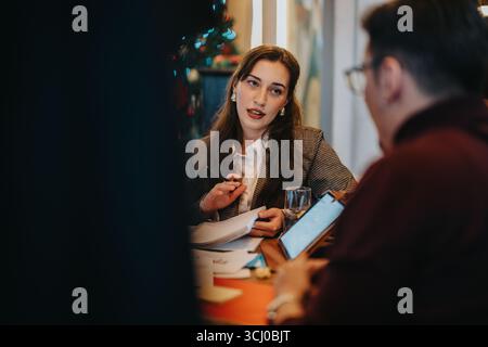 Professional meeting between colleagues during a business discussion in a relaxed setting Stock Photo