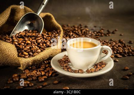 espresso steaming white cup roasted beans Stock Photo