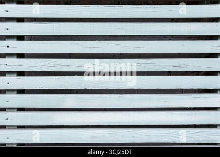 Close-up of a green, horizontally-slatted wooden fence, London, UK Stock Photo