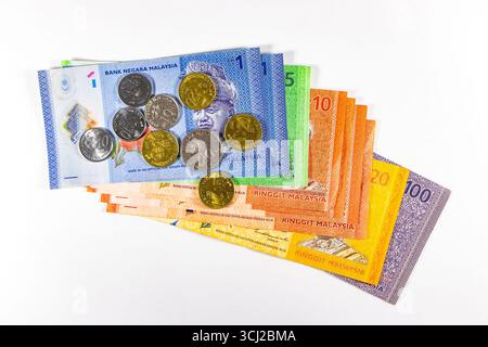 Malaysian Ringgits MYR currency comprising assorted colourful banknotes and coins on a white background Stock Photo