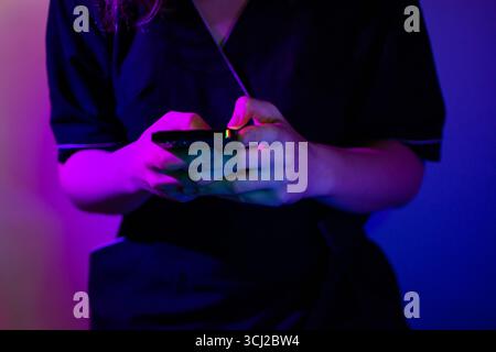 Woman use of cellphone at home. Communicating distantly and using smartphone at home. Stock Photo