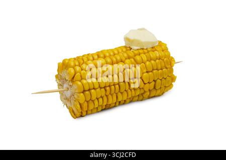 A single corn on the cob with a pat of butter melting on top, isolated on a white background. Stock Photo