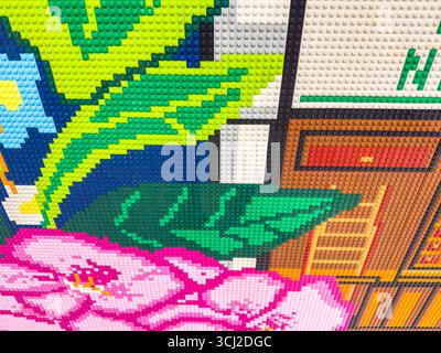 Colorful mosaic made from Lego  toy building bricks depicting abstract design with flowers and leaves without specific theme Stock Photo
