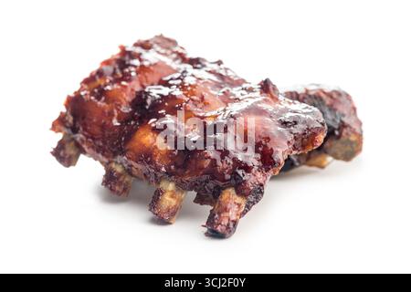 Pork BBQ glazed ribs isolated on a white background. Stock Photo