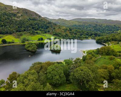 Cloudy summer day over the tranquil Rydal Water in the English Lake District, UK Stock Photo