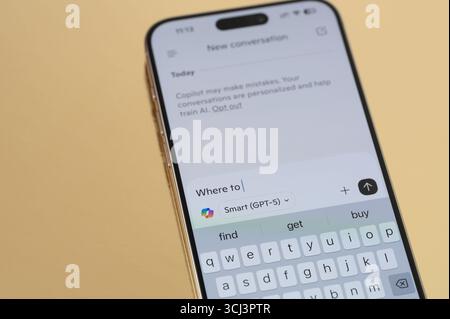 New York, USA - September 1, 2025: Typing promt on Microsoft Copilot  chatbot application close up view on smartphone screen Stock Photo