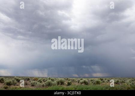 A cloudy sky with a storm in the distance Stock Photo
