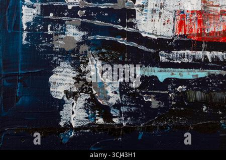Macro close-up of colorful and messy acrylic paints on dark blue background. Abstract high resolution full frame textured canvas background. Stock Photo