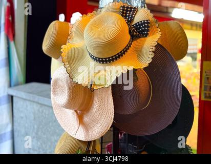 Summer hats with ribbon detail. Fashion, accessories, and seasonal style for outdoor activities. Stock Photo