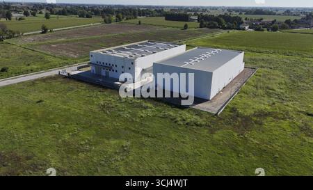 Cremona, Italy - August 22nd 2025 Modern Data Center Facility Under Construction in Rural Italian Landscape Symbolizing Future of Cloud Storage Techno Stock Photo