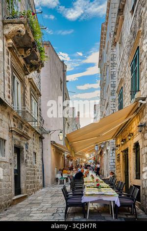 Visitors strolling and eating at restaurants and cafe's around the streets at and near the Stradun (also known as Placa) Dubrovnik, Croatia, Europe, Stock Photo