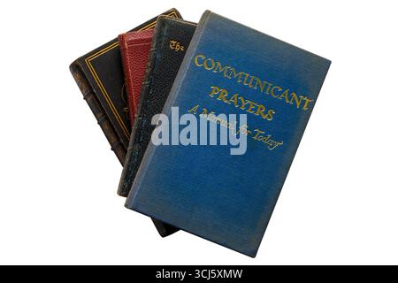 Selection of religious hardback books with Communicant Prayers a  manual for today book on top isolated on white background - from 1965 Stock Photo