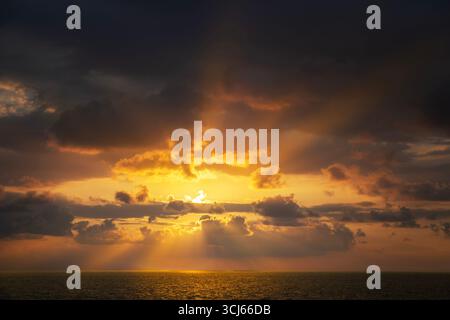 Sunset clouds over ocean. Hawaii, The Big Island Stock Photo