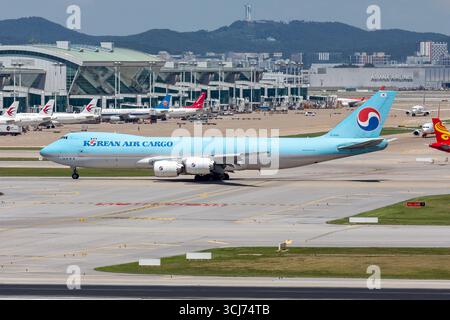 A photograph captures a Korean Air Cargo Boeing 747-8F at Incheon