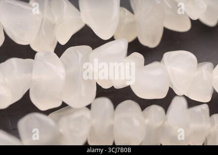 Beautiful healing stones on gray table, top view Stock Photo