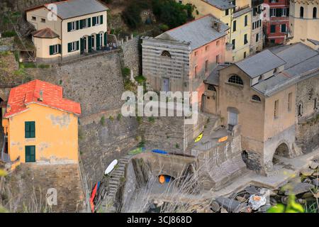 292 Sunset over the town's colorful, hillside-perched houses on the east side of the small port, and the Santa Margherita Church. Vernazza-Liguria. Stock Photo