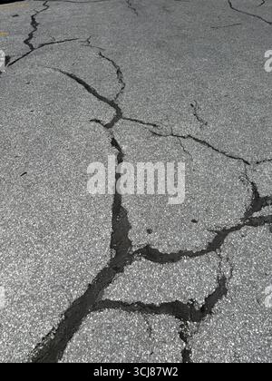 Patchwork on old asphalt parking lot. Stock Photo