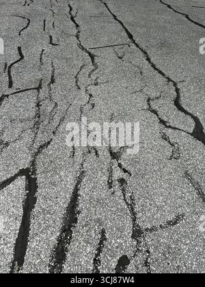 Patchwork on old asphalt parking lot. Stock Photo