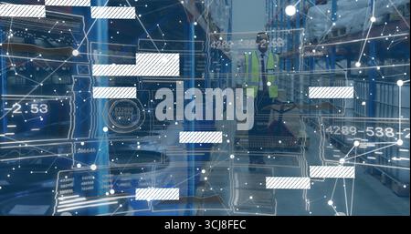 Walking male worker wearing high-visibility vest inside warehouse aisle with digital overlay Stock Photo