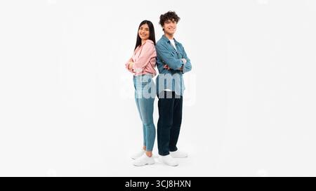 Happy Young Couple Posing Standing Over White Background Stock Photo