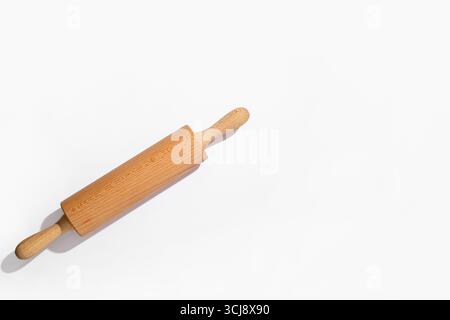 Wooden rolling pin on grey background Stock Photo