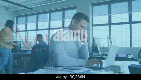 Typing man in light sweater pressing keys at open office desk, with laptop, floating data charts Stock Photo