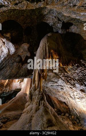 A stunning colorful cave with illuminated water and vibrant light ...