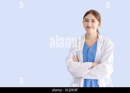 Portrait doctor nurse woman, Pharmacist or medical care person staff in Hospital in uniform arm folded happy smiling isolated with clipping path Stock Photo