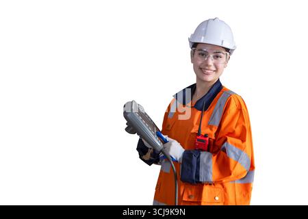 Happy smiling Asian engineer woman, smart people in modern industry with machine controller isolated on white background Stock Photo