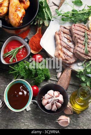 Grilled meat  on rustic wooden table. Top view Stock Photo