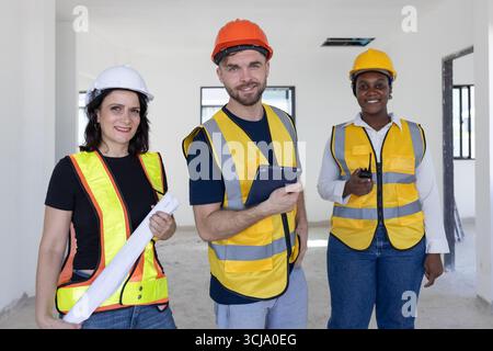 Group of Construction workers, Portrait Construction Engineer architect builder people team standing together happy smiling Stock Photo