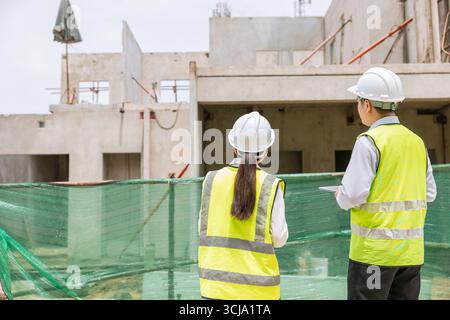 Construction engineer builder working team, Lead architect manager site inspection house construction project assessment process Stock Photo