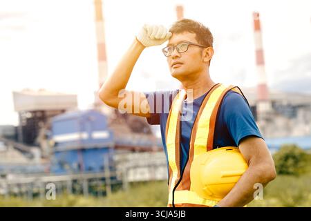Tired worker, Hard working outdoor, Engineer male exhausted sweating work in UV heat environment Stock Photo