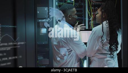 Network engineers in lab coats discussing and analyzing 3D data overlays in data center with racks Stock Photo