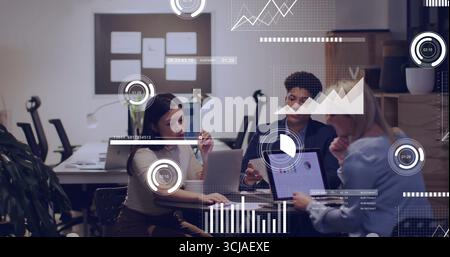 Collaborating three professionals analyzing charts on laptops and tablet at office meeting, board Stock Photo