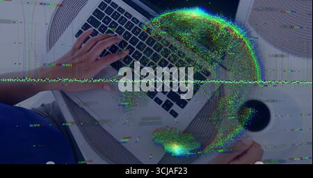 Hispanic woman typing on laptop holding coffee mug in home office with placemat, data globe Stock Photo